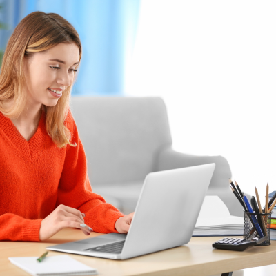 Person using a laptop to research house sitting opportunities