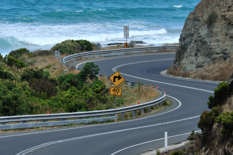 Scenic view of the Great Ocean Road curving along Victoria’s coastline.